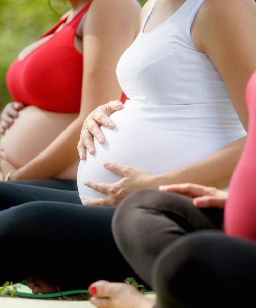pregnant-women-in-prenatal-class-touching-belly-2021-08-26-15-46-11-utc
